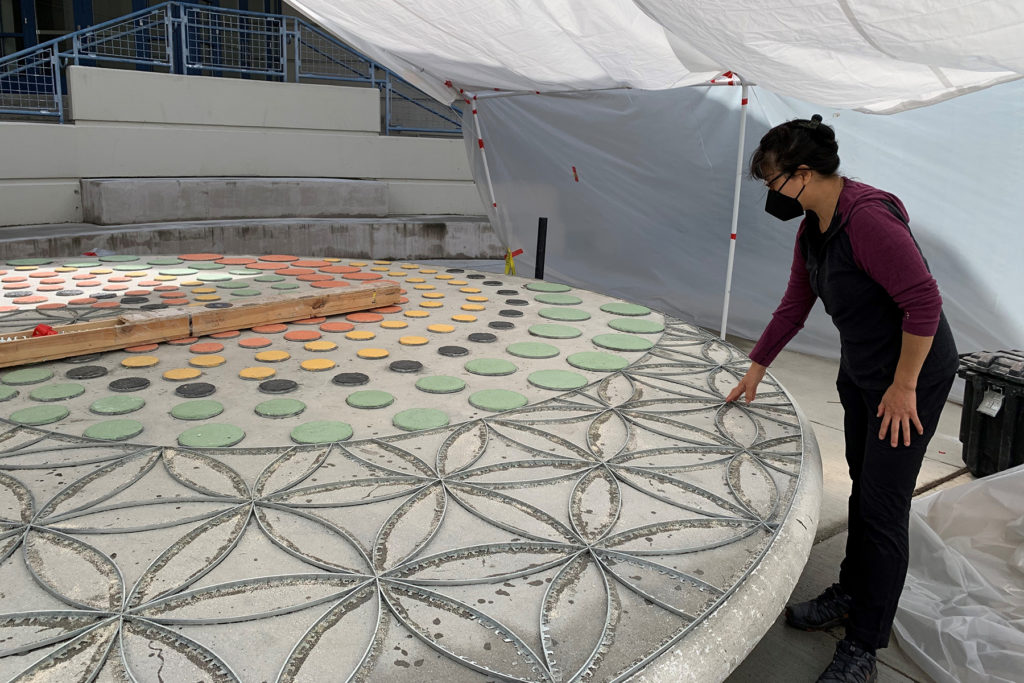 Artist installing art