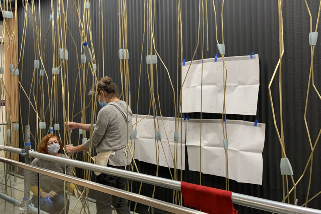 Artist installing art