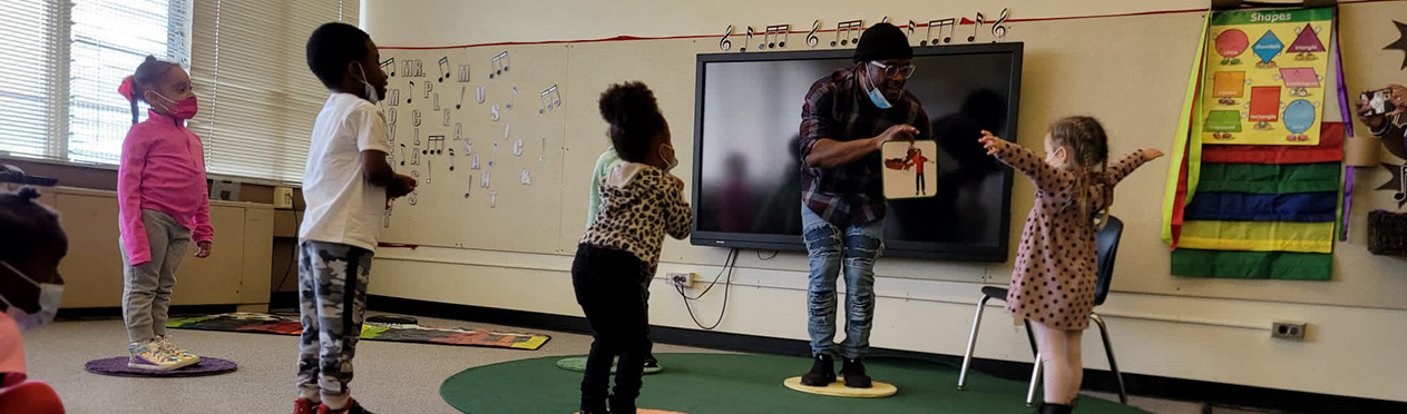 Mr. Pleasant teaching music and movement