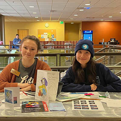 Kara Atkinson & Gabriella Smith at a WAM card writing event.